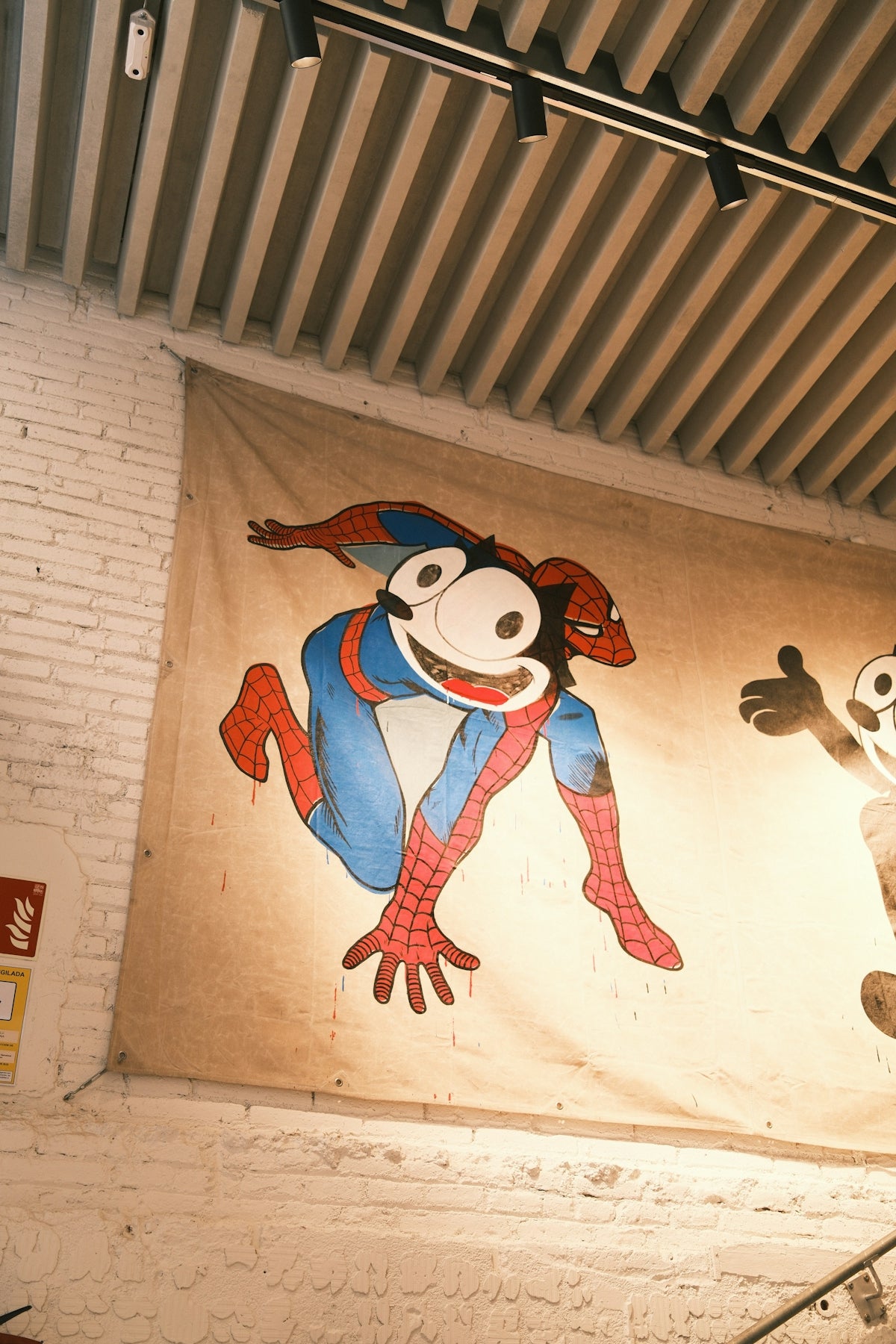 A mural of a monkey and a panda on a wall